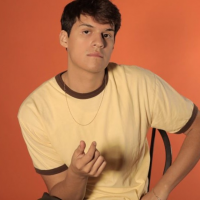 Watch Omar Apollo’s 80’s Technicolored Dance Party Video For “So Good”