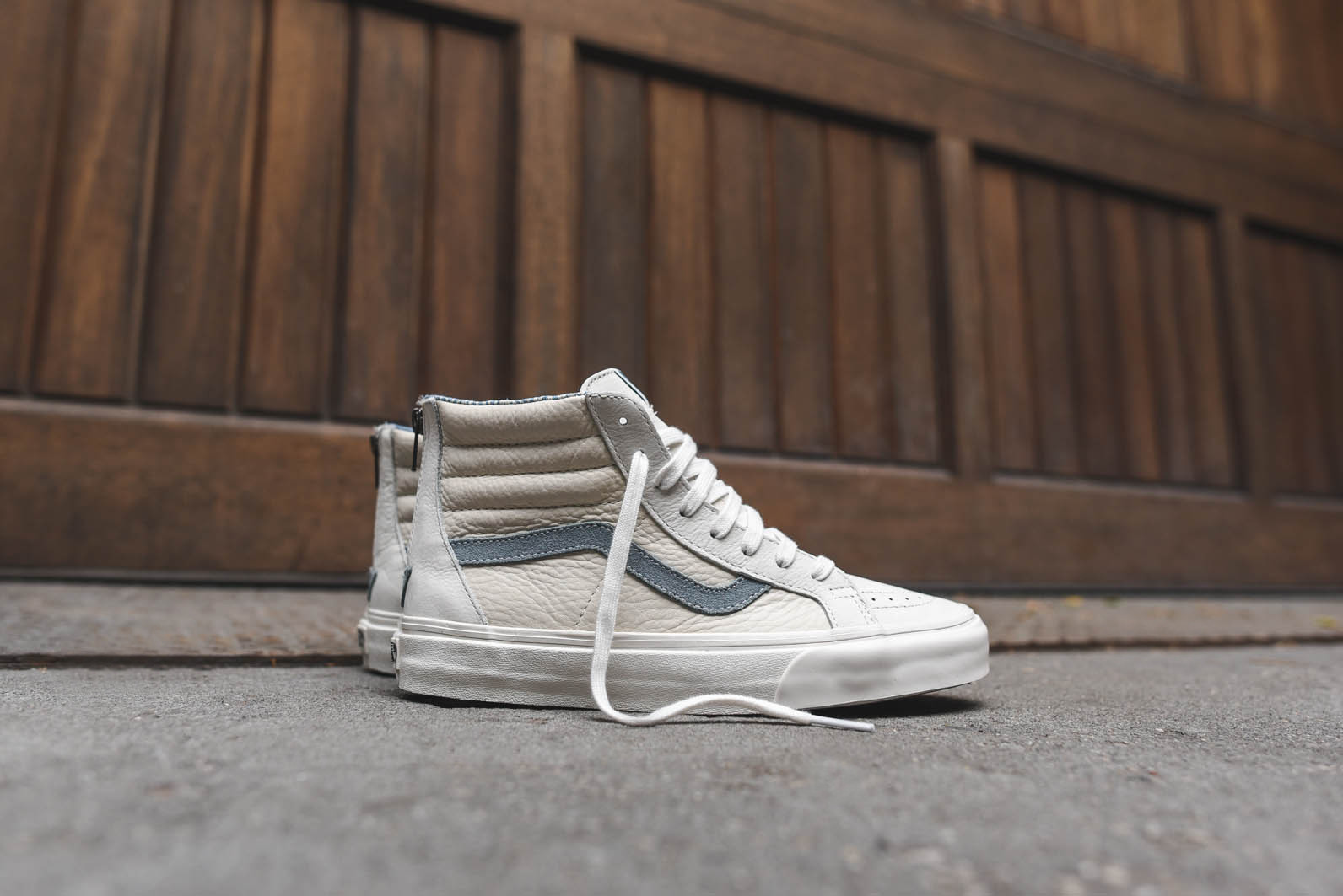 white high top vans with blue stripe